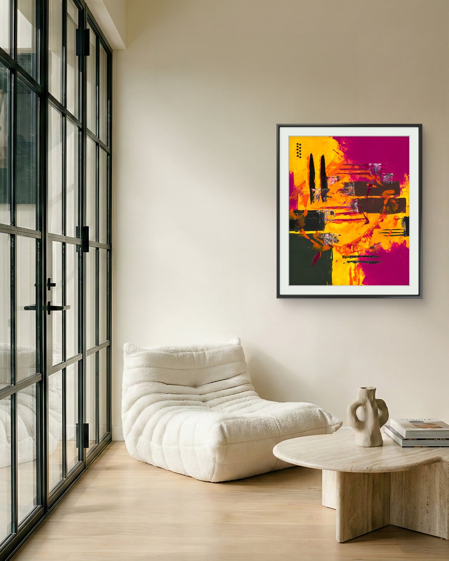 Modern living room with a white armchair, abstract art on the wall by Irish contemporary artist Áine Hayes and a wooden coffee table.
